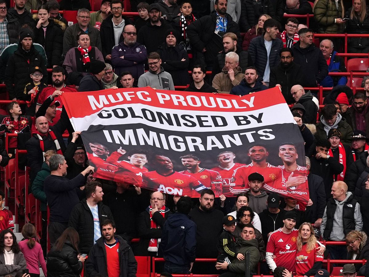 Man Utd fans display ‘MUFC proudly colonised by immigrants’ banner Man Utd fans display ‘MUFC proudly colonised by immigrants’ banner