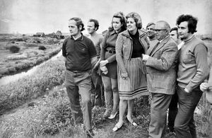 The West Bromwich West MP Miss Betty Boothroyd in August 1974 (in checked outfit). The story began: 'A West Midland MP is to ask a major water authority 'to get on with the job' of improving a polluted canal at Tipton. Miss Betty Boothroyd, Labour, West Bromwich West, is to ask the Severn Trent Water Authority for remedial work to start immediately following her latest visit to the polluted canal arm at Gospel Oak. Residents in the Newman Road area have complained bitterly about the problem from the 'raw sewage' canal at the rear of their homes.' 