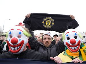 Supporting image for story: Man Utd supporters wear clown masks in protest ahead of Fulham match