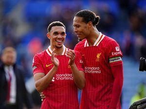 Liverpool’s Trent Alexander-Arnold (left) and Virgil van Dijk (right) celebrate at the final whistle