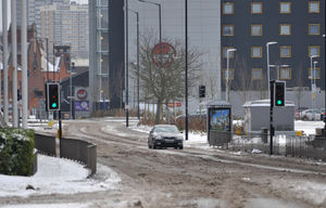 A lone car carefully makes its way along the usually busy Wolverhampton Street, Walsall
