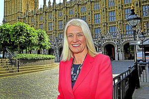Cannock Chase MP Amanda Milling in front of the Houses of Parliament