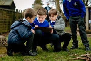Back in uniform and working closely with classmates
