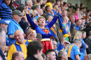 It's Super-fan! This supporter shows her true colours
