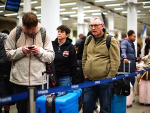 Passengers standing in a queue