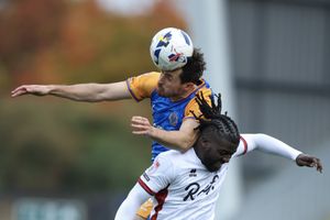 Sam Stubbs of Shrewsbury Town and Kabongo Tshimanga of Crawley Town
