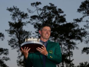 Rory McIlroy lifts the Masters trophy