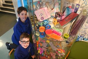 The 'Penny Kindness' shop. If they are kind they earn a penny credit, which they can exchange at a time when they have enough for a prize/gift. Pictured is: Reuben Newnes 10 and Henry Bennett 10.