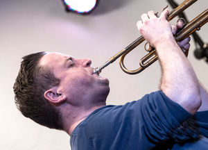 Big Band leader Nick Dewhurst soloing on trumpet