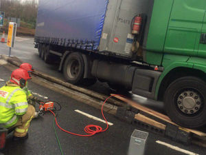 Supporting image for story: Firefighters work to free lorry stuck at Telford M54 services