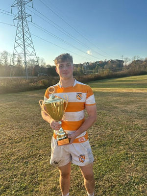 Gabe O'Reilly with the Southeasten Collgiate Rugby Championship trophy (Picture: Will Fagan)