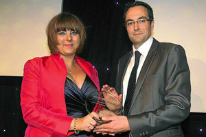 Clare Weaver picks up the trophy for classified advertising sales person of the year Carlie Clarke with Shropshire Star editor Martin Wright