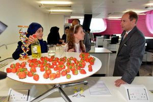 HRH Prince Andrew with A Level biology students Bushra Rangzeb, 17, and Alice Pledger, 18