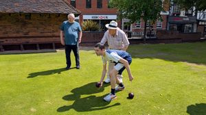 Past Captain Brian Lyons given tuition to a younger bowler