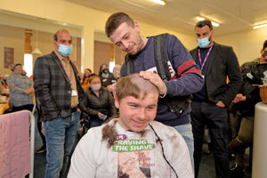 Alfie is pictured with his cousin and barber, Nathan Whitticase.