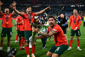Ruben Neves lifts the Nations League trophy (Photo by TOBIAS SCHWARZ/AFP via Getty Images)