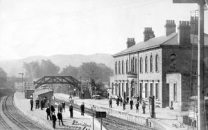 Llanidloes railway station. Llanidloes station. Unusually, this is an American postcard, franked at Troy, New York, on February 25, 1908. The postcard message was: 'Please send me a line Miss Mairs (this name uncertain) if the work is ready and I'll come at once. Yours truly, E.P. Jones. This picture was loaned by postcard collector Sally Anne Richards.