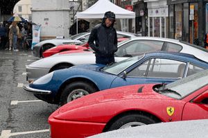 Visitors to the Bridgnorth Italian Moto Fest brave the horrendous downpours to view the cars on show