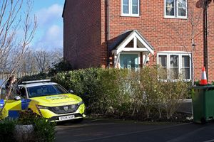 A man has been arrested on suspicion of murder after a woman was found in a critical condition in Devereux Gardens