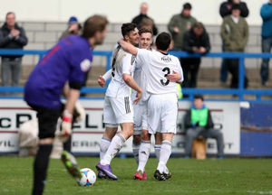 Andy Owens of AFC Telford United celebrates after scoring a goal to make it 2-0 with his team-mates Adam Farrell and Matty McGinn
