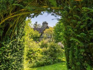 Supporting image for story: Grade-II listed farmhouse with own river and meadow gardens for sale