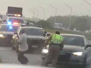 Supporting image for story: Highway Patrol officer pushes accident witness out of the way of oncoming Audi