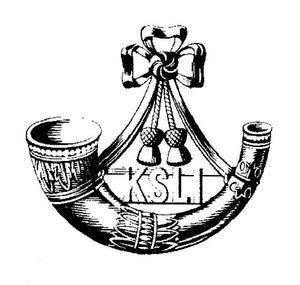The KSLI cap badge incorporates a bugle.