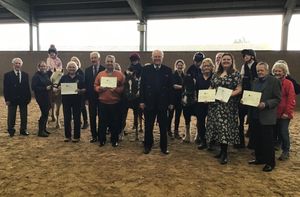 Masons Chris Farrer, Tony Hardwick and Richard Hoare, present cheques to Gill Smith with the High Riders, Glen Collins, Abbie Bissell-Blazier and Cllr Ken Henderson 