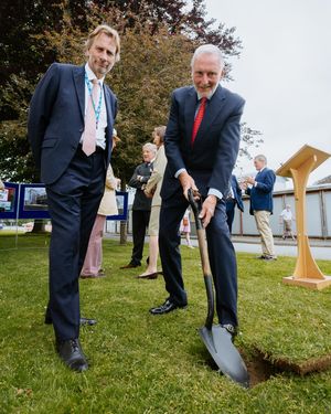 Air Vice Marshal Anthony J. Stables cuts the first turf with RJAH trust chairman Frank Collins