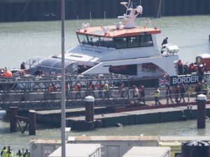 A group of people thought to be migrants are brought in to Dover