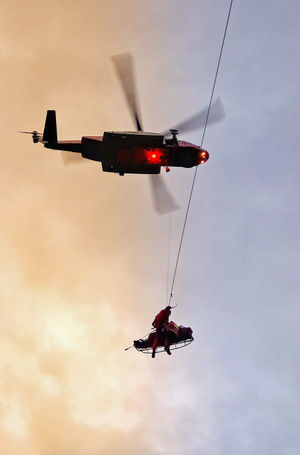 The man is winched to safety