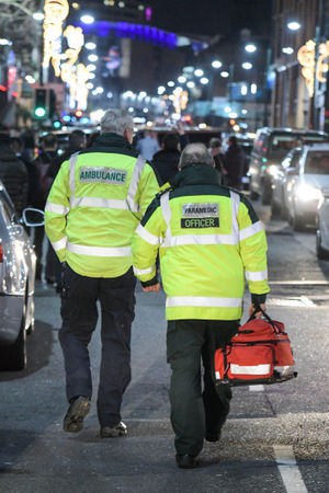 Paramedics walk up Broad Street in Birmingham as revellers partied hard last festive season