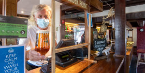 Many pubs will have protective screens around the bar