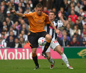 Rob Edwards in playing action for Wolves