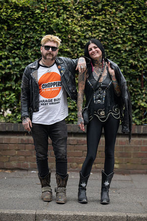 Music fans Zak Warman (L) and Kristen Chilcoat (R), from Detroit, arrive to attend British rock band Black Sabbath's "Back to The Beginning" concert, Ozzy Osbourne's final ever gig as Black Sabbath's frontman at Villa Park in Birmingham, central England on July 5, 2025. Osbourne, who revealed in 2020 that he has Parkinson's disease, will join Tony Iommi, Geezer Butler and Bill Ward for the all-day "Back To The Beginning" show in Birmingham, central England, where the heavy metal giants formed in 1968. (Photo by Oli SCARFF / AFP) (Photo by OLI SCARFF/AFP via Getty Images)          