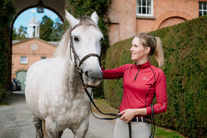 Zoe is fundraising to take part in the Mongol Derby. Pictured here with a horse she looks after called Silver