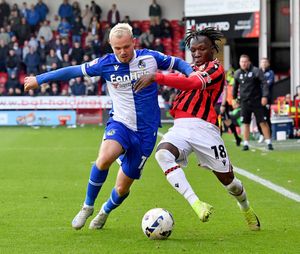 Walsall’s Vincent Harper battles with Bristol Rovers’ Luke Thomas
