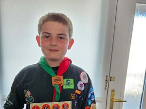 Supporting image for story: Boy, 10, celebrates achieving all 57 Cubs badges