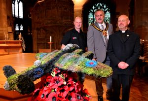 Paul Mincher (left) from Bud's Florists, pictured with Mayor of Wolverhampton, Cllr Ian Brookfield, and Prebendary David Wright. Pictured with the Lancaster Bomber made by Paul on display at St Peter's Church, Wolverhampton. The Lancaster was to be auctioned off after Remembrance Sunday in aid of a charity
