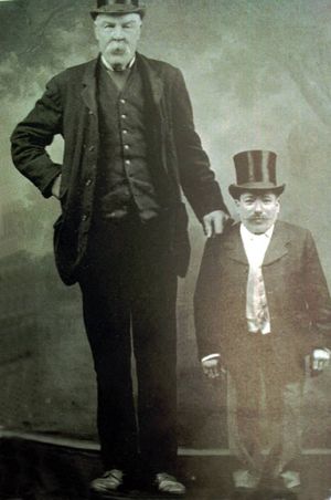 Tom Dutton, the Shropshire Giant – is he the man on the back row? This photo shows him with Tom Sillitoe, a well known waistcoat designer. 