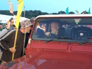 John Holding with his Wolves flag when he met Michael Eavis, Glastonbury Festival foudner