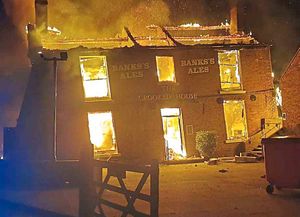The Crooked House burning on Saturday night. Photo: Chris Green
