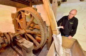 Volunteer Cliff Bassett inside the mill