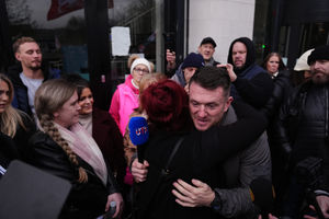 Tommy Robinson hugs o a member of Rhiannon Whyte's family outside  Coventry Crown Court after asylum seeker Deng Chol Majek was jailed for life with a minimum term of 29 years for murdering hotel worker Rhiannon Whyte on a railway station platform in Walsall in October 2024. Picture date: Friday January 30, 2026. PA Photo. Photo credit: Jacob King/PA Wire