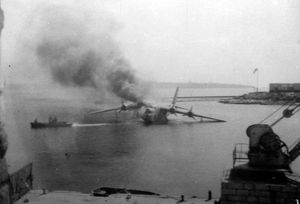 A Sunderland flying boat burning after being shot up by German fighters.