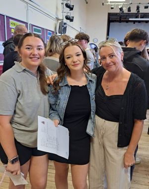 Abbie Hutchings celebrating with her mother and sister