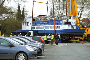 Inspectors checked underneath after the Sabrina was lifted from the River Severn by crane to dry dock on Frankwell car park