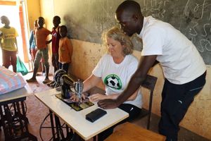 George teaching Lissa how to make reusable sanitary ware