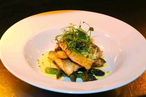 A bookshelf next to the bar is crammed full with food and drink guides, many of them doubtless extolling the Colliers' virtues.