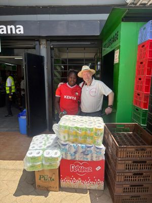Neil Hope with items purchased by Lottie's Way for Gracious Givers - with Moureen Achieng - in Gilgil.